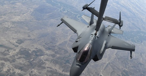 An image released by the USAF of one of  two F-35As enroute to its first combat mission show the aircraft configured for non-stealthy operations, with externally-mounted AIM-9X Sidewinder short-range air-to-air missiles and Luneburg lens radar reflectors.