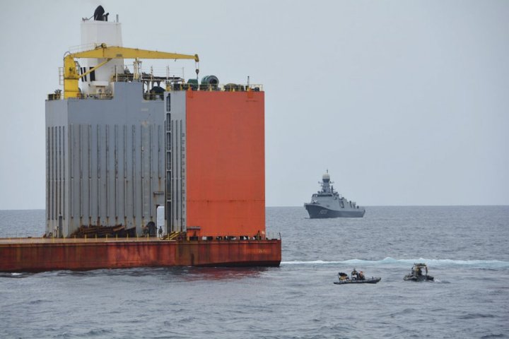 
        The Equatorial Guinea navy frigate
        Wele Nzas
        is seen behind
        Blue Marlin
        after it was boarded by the Spanish marines on 6 May.
       (Spanish Navy)