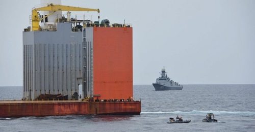 The Equatorial Guinea navy frigate 
        
         is seen behind 
        
         after it was boarded by the Spanish marines on 6 May.