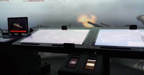A scaled-down mock-up of ST Engineering's integrated naval ship simulator at IMDEX 2019.