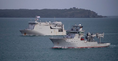 The RNZN's future hydrography ship, 
        
         (front), is seen here arriving in Auckland, New Zealand, in mid-May accompanied by HMNZS 
        
         (back).