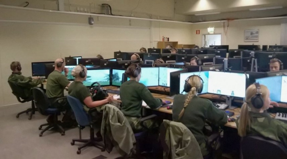 A fixed StrisimPC installation. A trainee can be seen with a steering wheel on the left.
