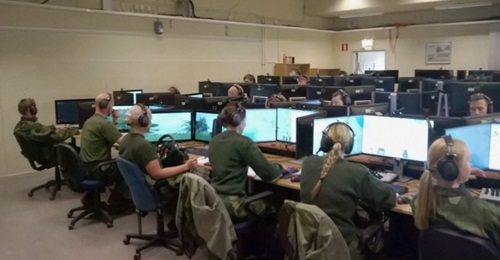A fixed StrisimPC installation. A trainee can be seen with a steering wheel on the left.