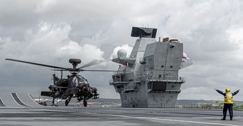 A British Army Apache AH1 landed on HMS 
        
         for the first time on 3 June. The UK has committed the carrier to NATO's Readiness Initiative.