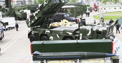 The Polonez-M MLR system with full-size mock-up of the tactical missile and its canister.