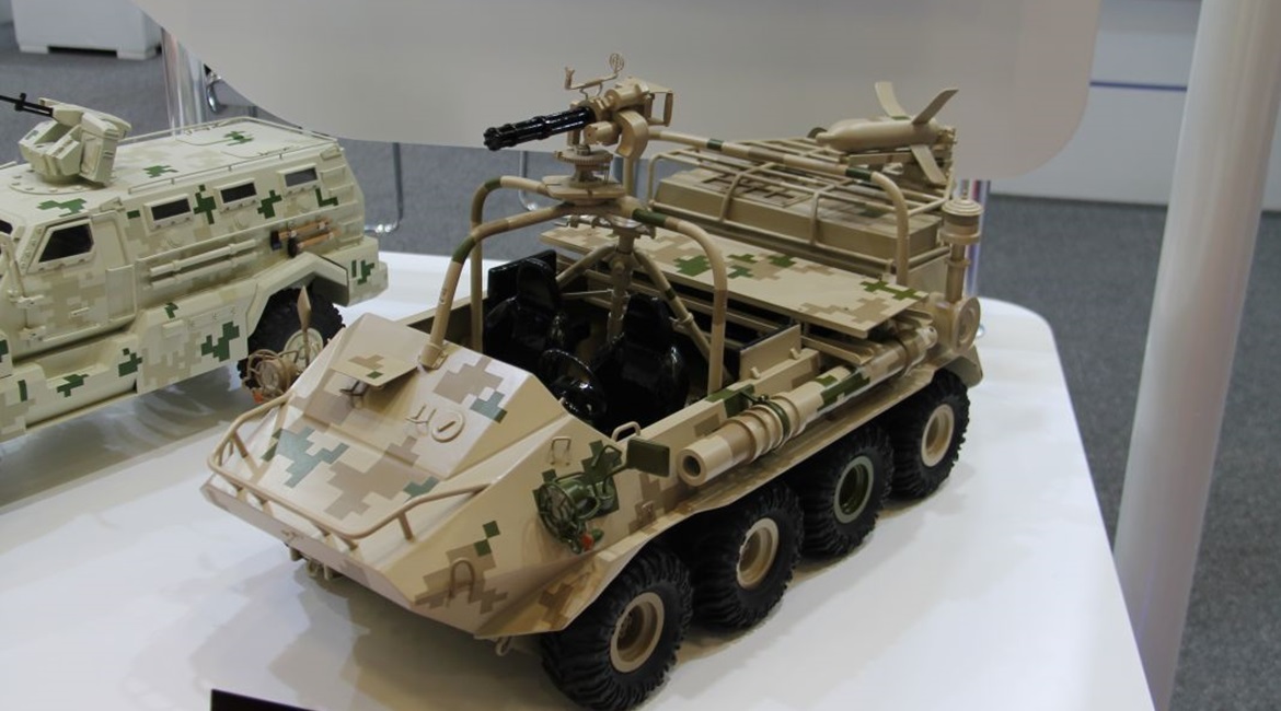 A scale model of the CS/VP4 8×8 ATV with a Gatling MG and Red Arrow 73 series ATGM on a launcher rail.