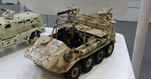 A scale model of the CS/VP4 8×8 ATV with a Gatling MG and Red Arrow 73 series ATGM on a launcher rail.