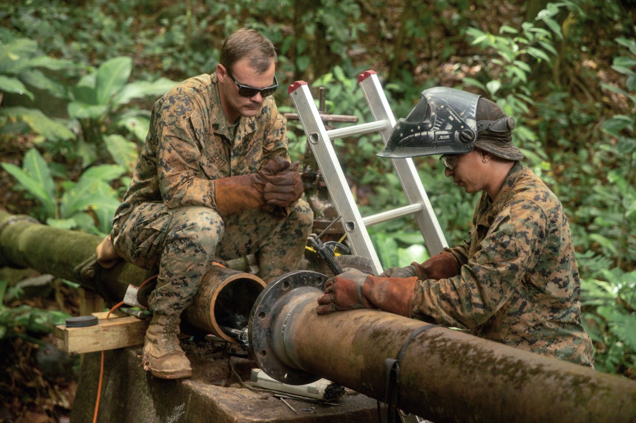 A US Marine with the SPMAGTF-SC assesses the repair process on a broken water valve in Trujillo, Honduras, during a 2018 deployment to Central America. Despite the Trump administration’s pledge to cut off aid to El Salvador, Guatemala, and Honduras, the SPMAGTF-SC has once again deployed to the region to help train the three nations’ militaries during the 2019 hurricane season. (US Department of Defense/Sergeant Justin Smith)