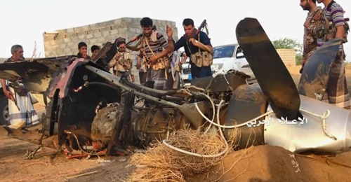 Ansar Allah fighters inspect the wreckage of a UAV that was shot down in Yemen on 6 June. CENTCOM has confirmed it was a US-operated MQ-9.
