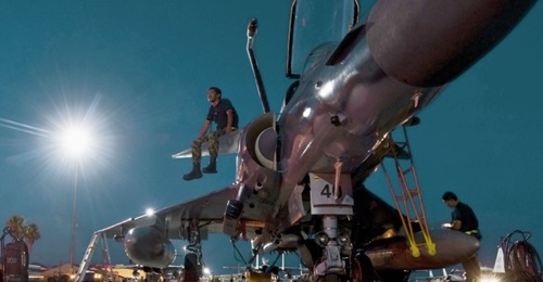 A Colombian air force technician sits on the canard of a Kfir during a 'Red Flag' exercise in 2012. IAI hopes to sell the enhanced Kfir NG to Colombia, and expects to return to service aircraft for Sri Lanka and Ecuador.