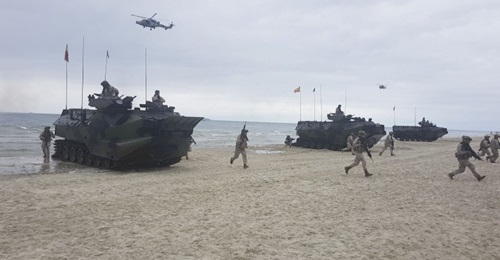 Spanish marines and armoured amphibious assault vehicles, deployed from the US Navy's Whidbey Island-class LSD amphibious assault ship USS 
        
        , come ashore on Palanga Beach, Lithuania, in an amphibious demonstration during 'BALT...