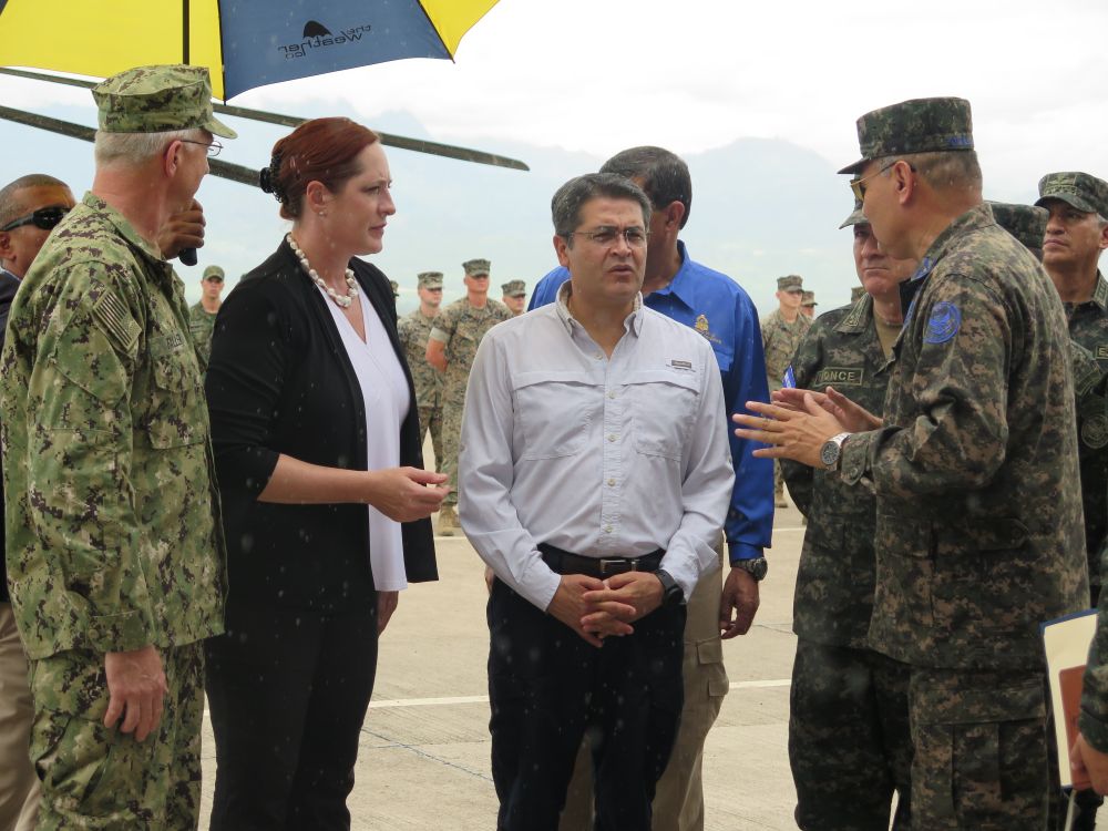 Honduran President Juan Orlando Hernández (centre) talks with USSOUTHCOM Commander Admiral Craig Faller (far left), the US Chargé d’Affaires to Honduras Heide Fulton (left), and other military officials from the region on 21 June. Military leaders gathered at Soto Cano air base in Honduras for the opening ceremony of a US SPMAGTF-SC that will be in the region for the 2019 hurricane season. (Ashley Roque/Janes)