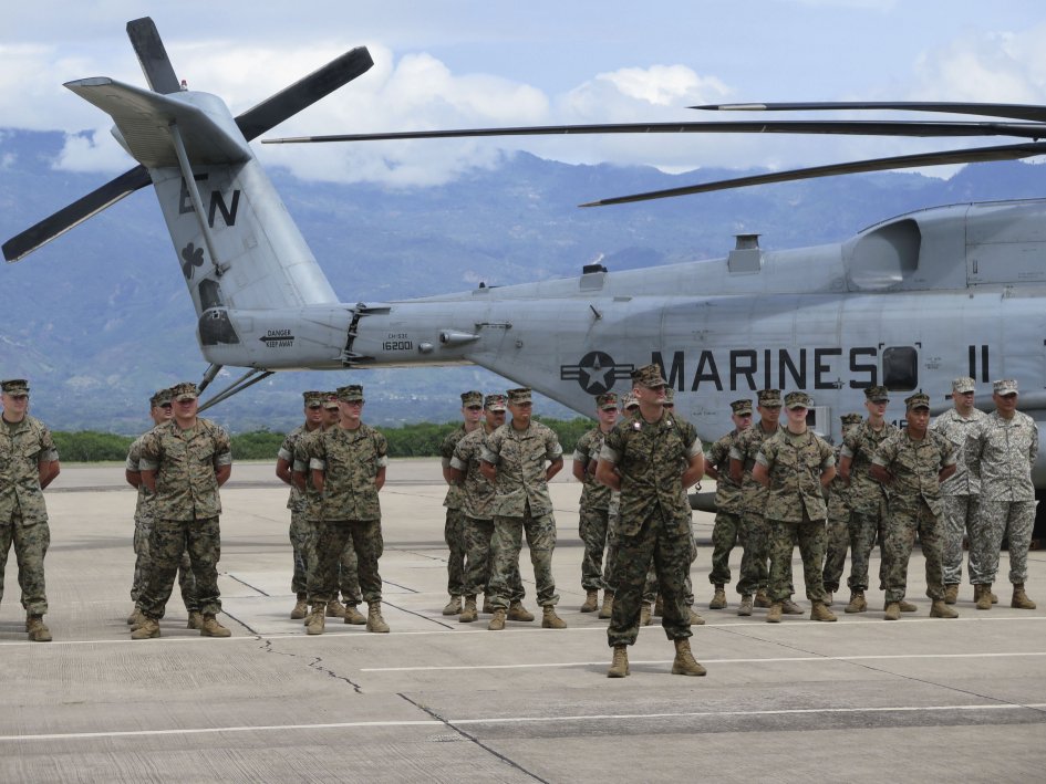 US Marines participate in the 21 June SPMAGTF-SC opening ceremony at Soto Cano air base outside of Comayagua, Honduras. As part of the SPMAGTF-SC, nearly 300 US marines and sailors have deployed to Belize, El Salvador, Guatemala, and Honduras, to help train local forces, and provide assistance if a natural disaster occurs. (Ashley Roque/Janes)