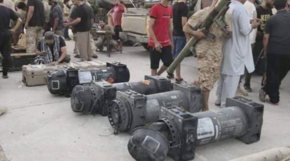 GNA fighters inspect weapons, including containers for Javelin anti-tank missiles, purportedly recovered during the capture of Gharyan.
