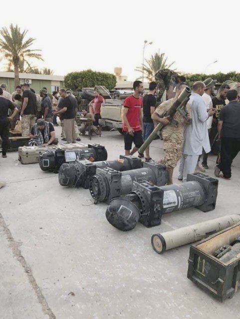 GNA fighters inspect weapons, including containers for Javelin anti-tank missiles, purportedly recovered during the capture of Gharyan.