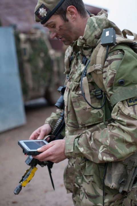 A Scots Guards sergeant with an infantry terminal introduced as part of the infrastructure element of BCIP 5.6. (British Army)