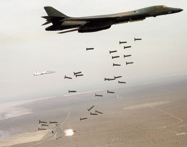 A B-1B bomber dropping cluster munitions during tests. The USAF is replacing this class of weapon that spreads live bomblets across a large area with a family of next-generation bombs that use fragmentation to achieve the same effect. (US Air Force)