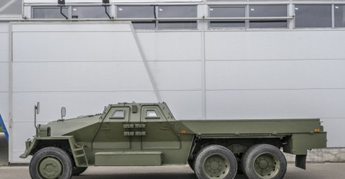 The upgraded Praga VS35, showing the new four-door protected cab. The flatbed's sides fold down to fit the twin 30 mm weapons.