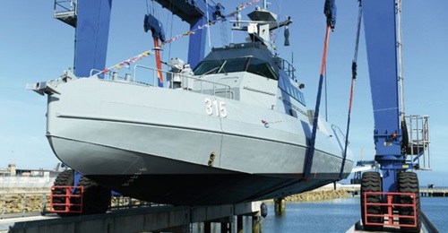 A Saudi HSI32 fast patrol boat is seen in a shiplift at Cherbourg.