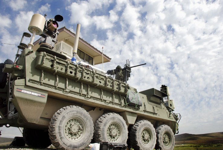 A Stryker with the 5 kW laser, mounted on the vehicle’s rear. The US Army has decided to accelerate development of its MMHEL effort that seeks to integrate a 50 kW-class laser on the vehicle. Northrop Grumman and Raytheon are now competing to design the laser for four prototype vehicles. (DIVIDS)