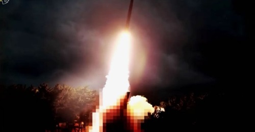 A screengrab from a video aired by KCTV on 1 August showing a pixelated image of what Pyongyang described as a new North Korean “large-calibre multiple launch rocket system” that was reportedly tested on 31 July.