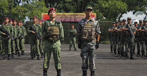 Participating units from the Singapore Armed Forces and the People's Liberation Army stand at attention during the opening ceremony of Exercise 'Co-operation 2019'.