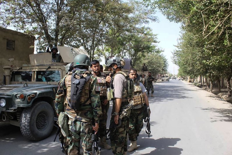 Afghan forces gather at a street in Kunduz on August 31 as they co-ordinate efforts to repel a Taliban assault on the northern Afghan city. (Bashkir Khan Safi/AFP/Getty Images)