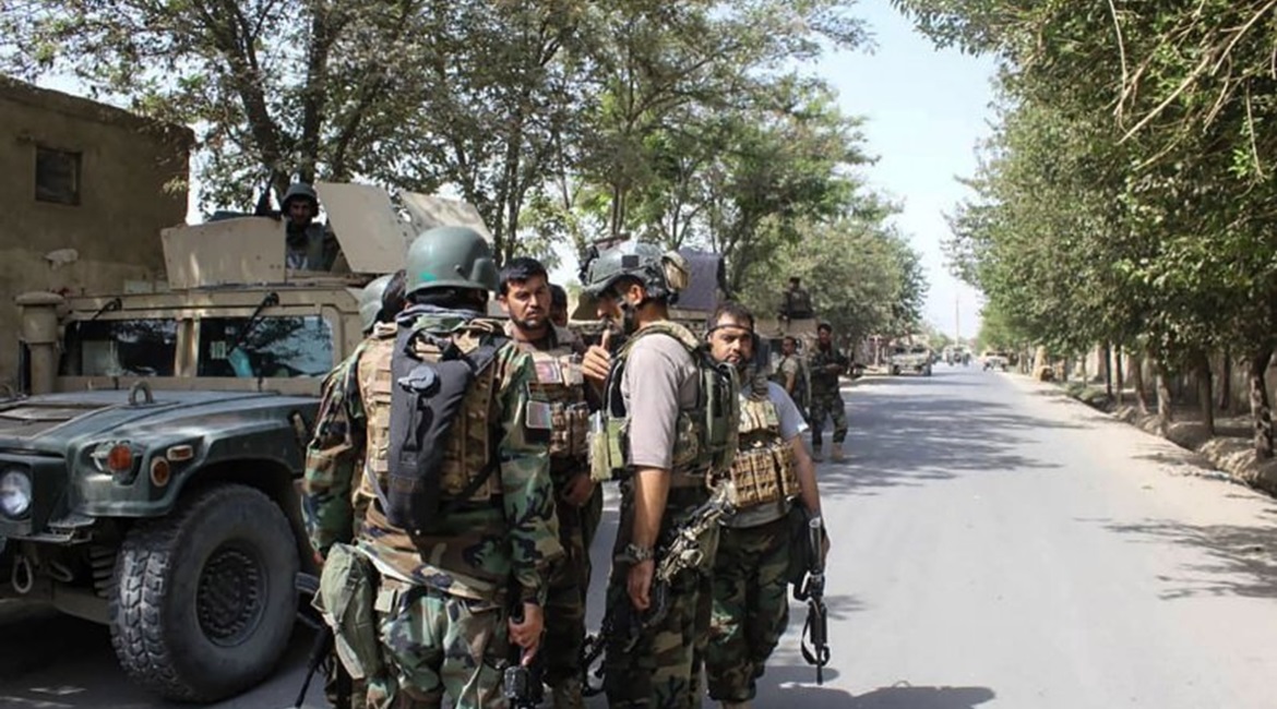 Afghan forces gather at a street in Kunduz on August 31 as they co-ordinate efforts to repel a Taliban assault on the northern Afghan city.