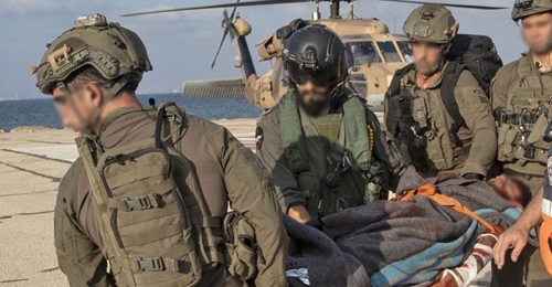 Israeli soldiers unload what appeared to be a casualty at Ramban hospital in Haifa after a Hizbullah missile attack on the Lebanese border. The IDF subsequently announced the attack caused no casualties.