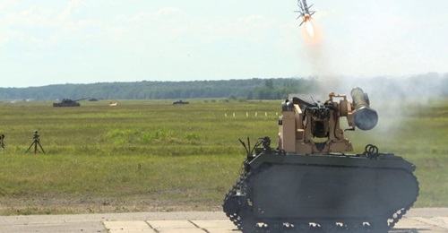 A Javelin anti-tank guided missile being fired from the Titan UGV for the first time.