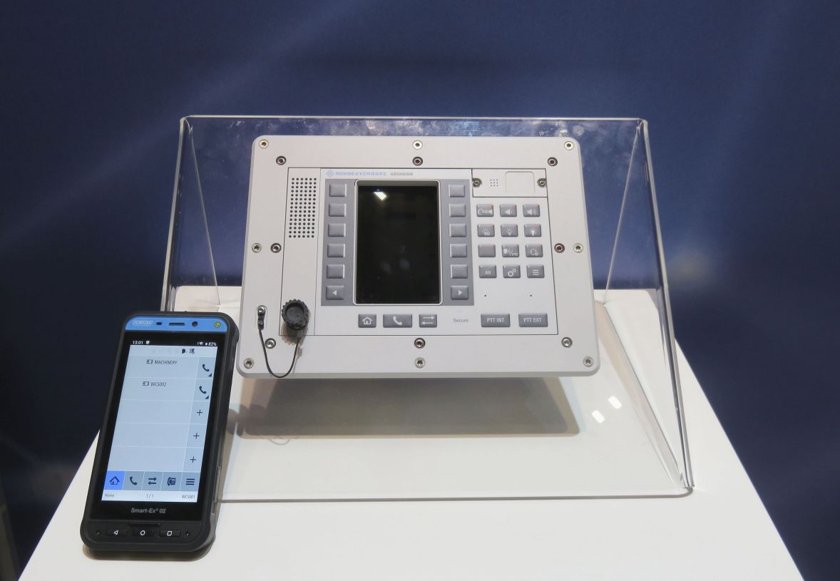 A Rohde & Schwarz NAVICS fixed terminal and a mobile voice terminal displayed at DSEI 2019. (Giles Ebbutt)