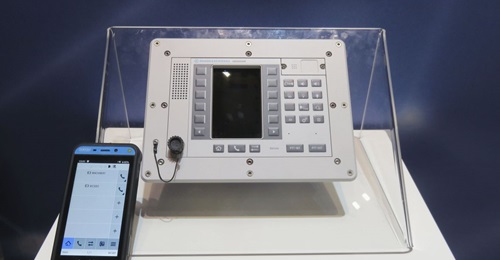 A Rohde & Schwarz NAVICS fixed terminal and a mobile voice terminal displayed at DSEI 2019.