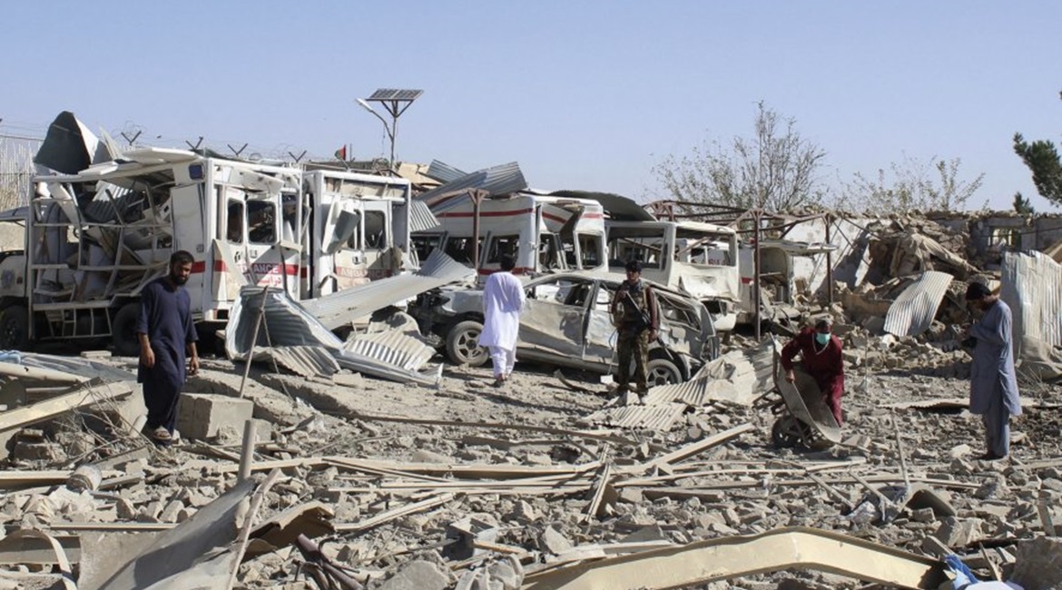 Afghan security forces investigate the site where a Taliban car bomb exploded near an intelligence services building in Qalat, Zabul Province, on 19 September.