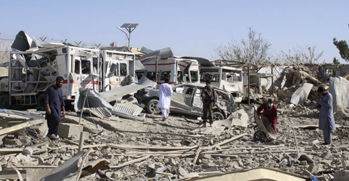 Afghan security forces investigate the site where a Taliban car bomb exploded near an intelligence services building in Qalat, Zabul Province, on 19 September.