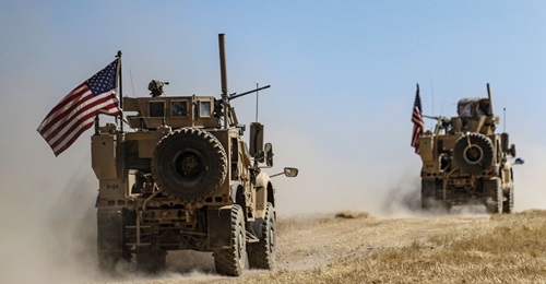 A US military convoy participates in joint patrol with Turkish troops in the Syrian village of al-Hashisha on the outskirts of Tell Abyad along the border with Turkish troops on 8 September. The US has approximately 1,000 troops inside Syria on safe zo...