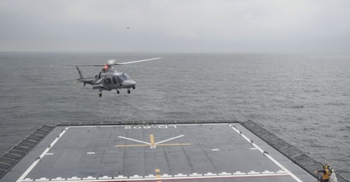 A Philippine Air Force AW109 helicopter approaching BRP 
        
         as part of its deck landing trials.
