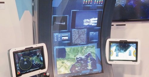Pictured here is the Thales Mission@ISR concept demonstrator displayed at DSEI 2019. On the single curved screen from the top are: circular menu; mission data for two UAVs; two electro-optical sensor feeds; AIS track data; overhead imagery; and overall...