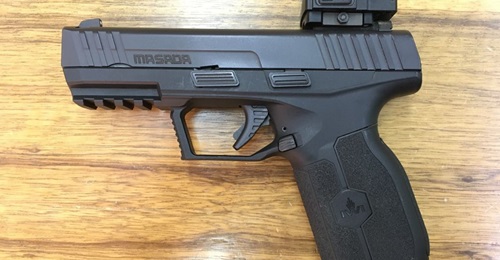 IWI's 9 mm Masada pistol, shown with a Meprolight red-dot sight.
