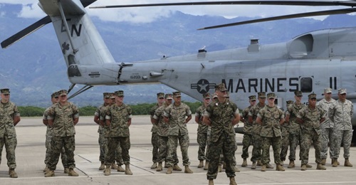 US Marines participate in the 21 June SPMAGTF-SC opening ceremony at Soto Cano Air Base outside of Comayagua, Honduras. Members of the task force are now in Colombia for a week of humanitarian assistance training.