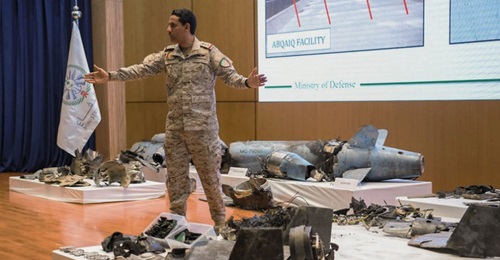 Saudi military spokesman Colonel Turki al-Maliki stands amongst the remnants of cruise missiles and UAVs recovered after the 14 September attacks on Saudi oil facilities.