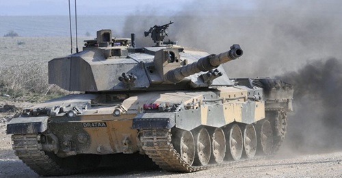 A British Army Challenger 2 MBT showing the protected housing for the Thermal Sighting System mounted externally above the rear of the 120 mm L30A1 rifled gun, and with cover open.