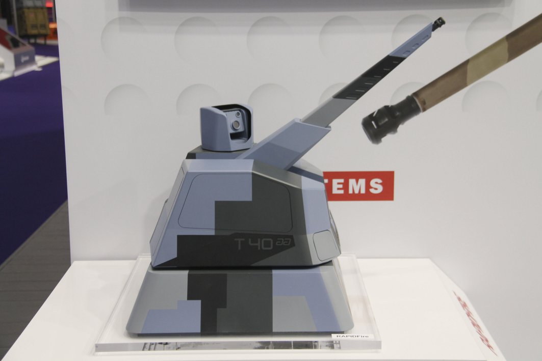 A scale model of the Thales/Nexter RAPIDFireNaval weapon system armed with a 40 mm Cased Telescoped Armament System, and showing the sensor pod mounted on the roof. (Christopher F Foss)