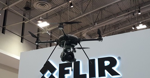 FLIR Systems' R80D SkyRaider multi-mission unmanned rotorcraft on display at the 2019 AUSA convention. The large camera on the bottom of the aircraft is a new StormCaster-T thermal camera with FLIR Boson sensor.