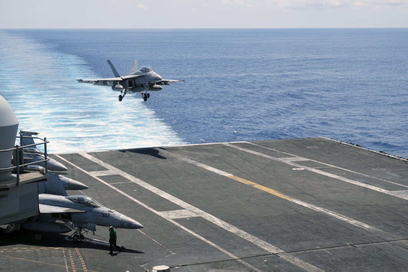 
        An F/A-18 approaching USS
        Ronald Reagan
        for a full-stop landing after flight operations in the South China Sea.
       (IHS Markit/Ridzwan Rahmat)