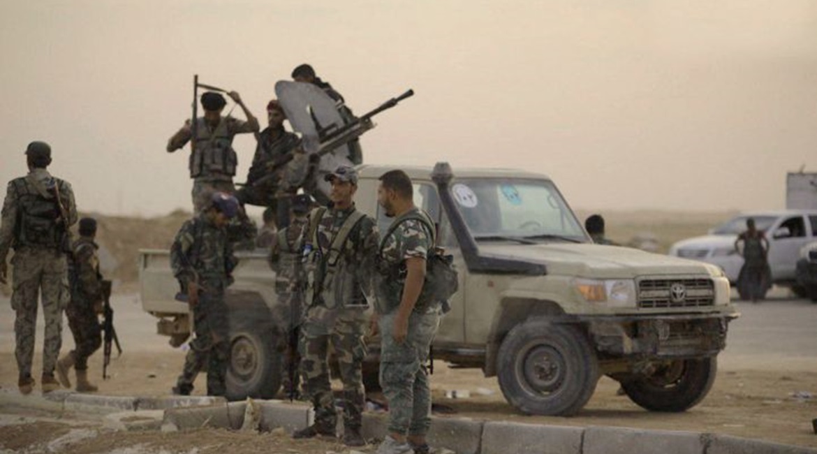 Syrian government troops are seen at Al-Tabqah Air Base, which was previously controlled by Kurdish forces, on 14 October.