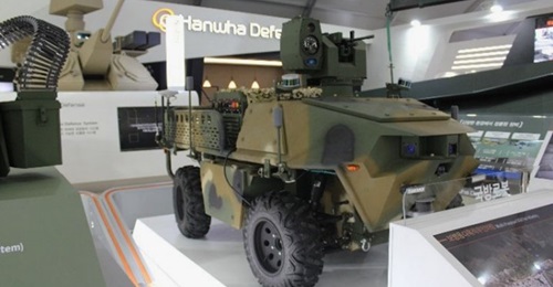 Hanwha Defense displayed a multipurpose 4x4 UGV equipped with a K3 5.56 machine gun and an EO/IR sensor unit at the ADEX 2019 exhibition.