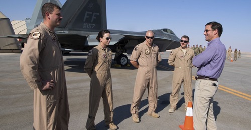 US Secretary of Defense Mark Esper talks to pilots in front of an F-22 Raptor at Prince Sultan Air Base on 22 October.