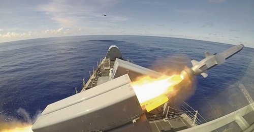 USS 
        
         (LCS 10) fires a Naval Strike Missile.