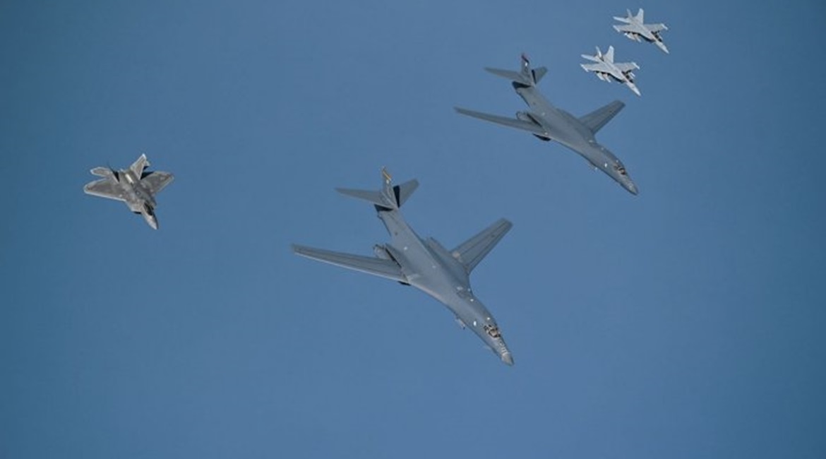 Two B-1B bombers are escorted over the Gulf by an F-22 Raptor and two EA-18G Growlers on their way to Prince Sultan Air Base in Saudi Arabia.