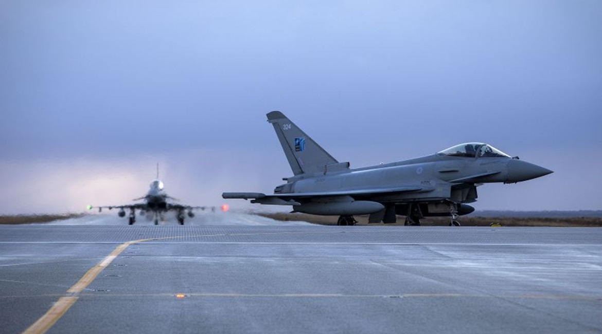A pair of RAF Typhoons taxi to their parking apron after arriving at Keflavik Air Base on 13 November.